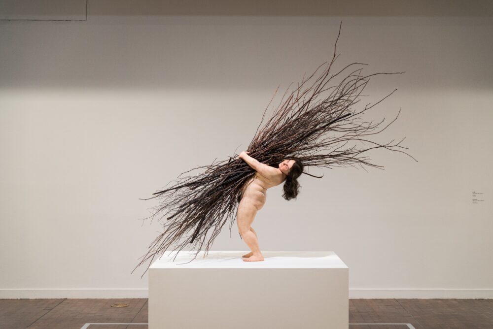 Woman with Sticks by Ron Mueck Fondation Cartier pour l